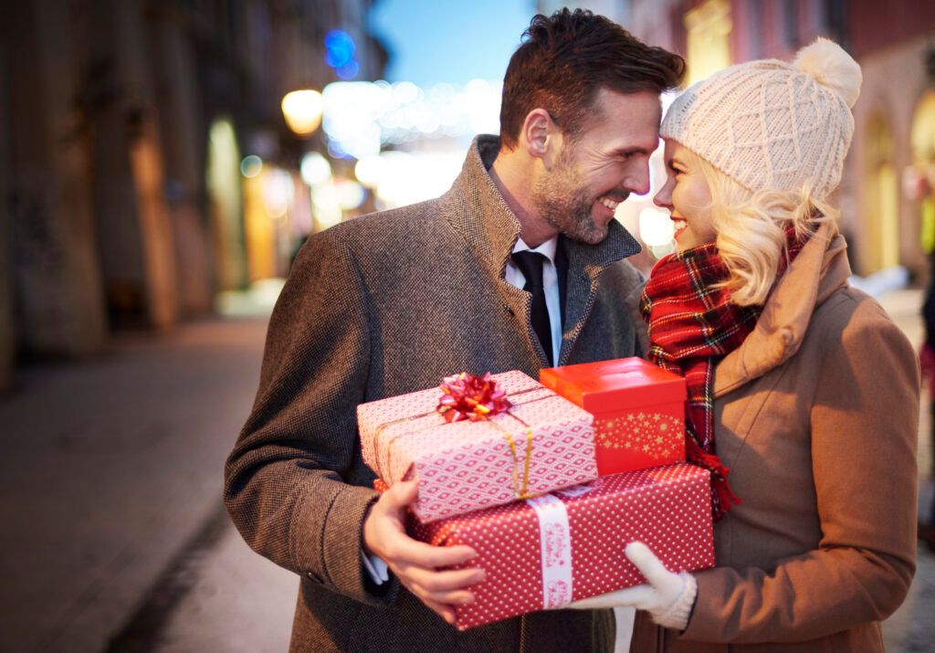 affectionate-couple-with-stack-presents-1024x715.jpg