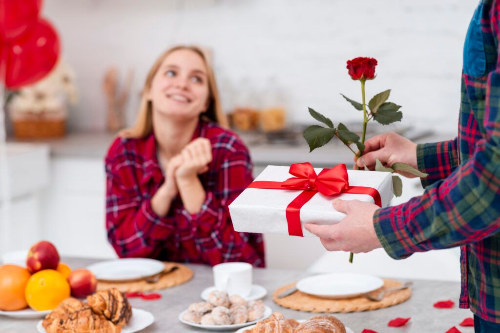 close-up-man-surprising-woman-with-rose-gift-1024x683.jpg
