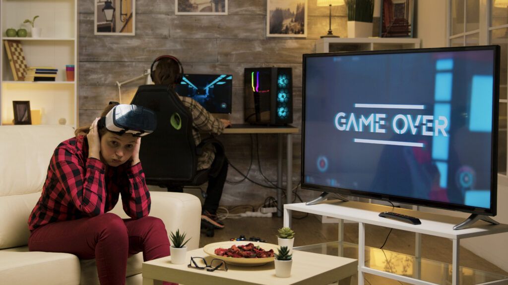 woman-experiencing-virtual-reality-while-playing-video-games-using-vr-headset-game-female-gamer-1024x576.jpg