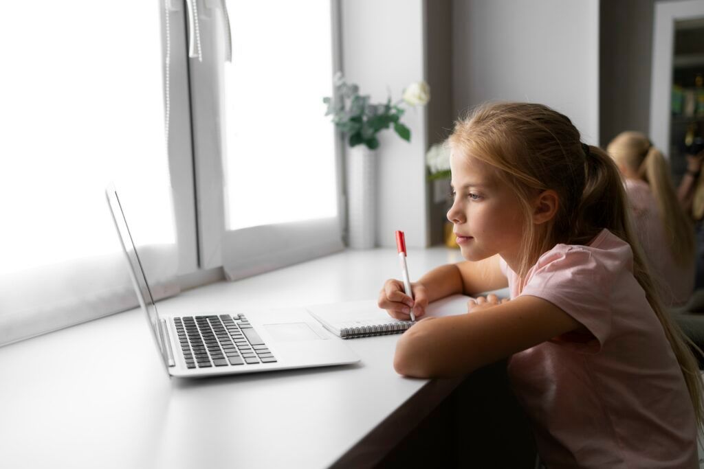 little-girl-doing-homework-home-with-laptop-notebook-1024x683.jpg