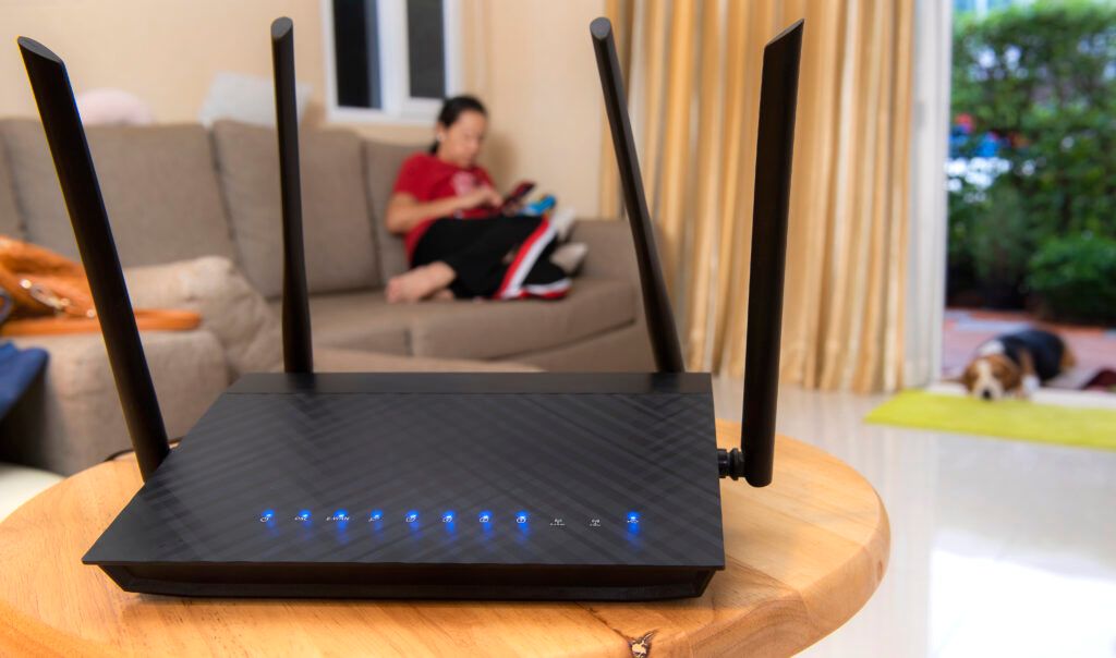 wireless-router-woman-using-phone-living-room-home-1024x604.jpg