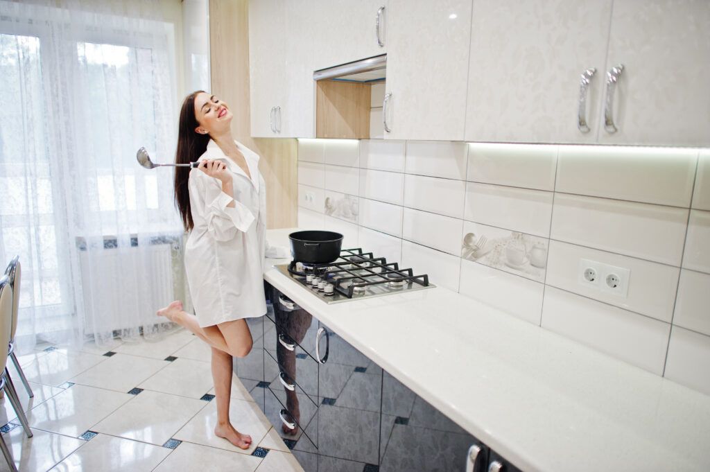 brunette-girl-wear-shirt-underwear-cooking-white-kitchen-1024x681.jpg