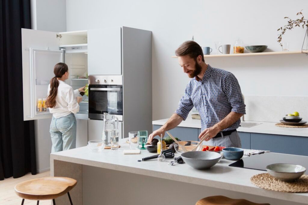medium-shot-couple-cooking-kitchen-1024x683.jpg