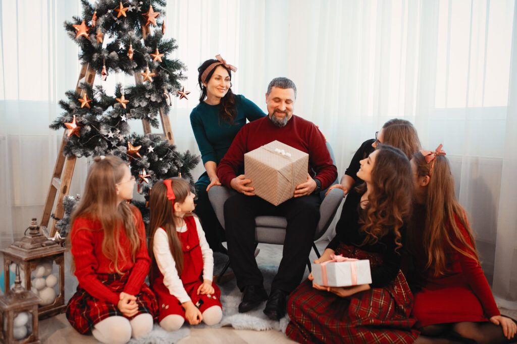 big-family-sitting-home-near-christmas-tree-1024x683.jpg