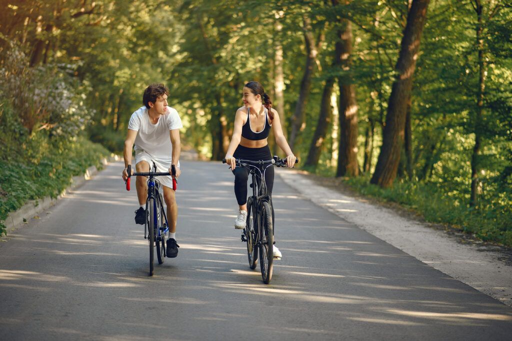 sports-couple-riding-bikes-summer-forest-1024x683.jpg