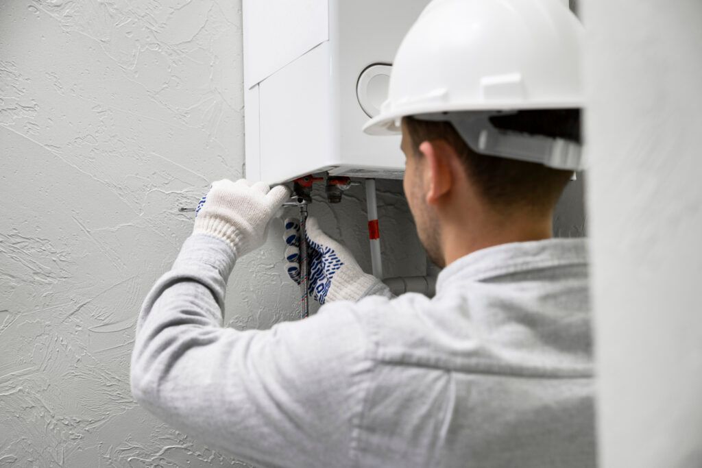 worker-repairing-water-heater-1-1024x683.jpg