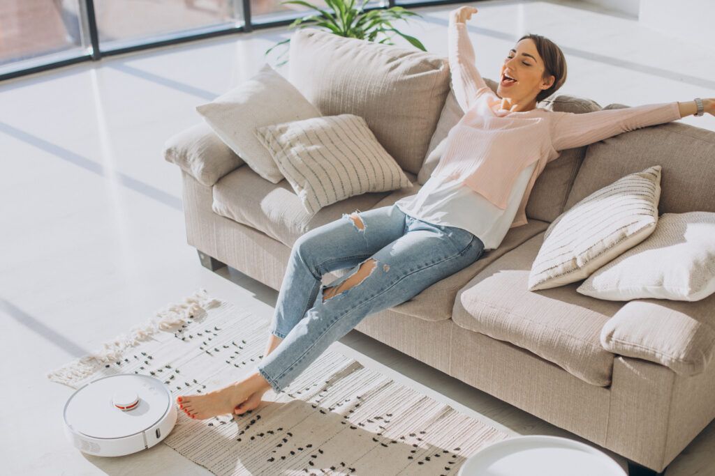 woman-relaxing-sofa-while-robot-vacuum-cleaner-doing-housework-1-1024x683.jpg