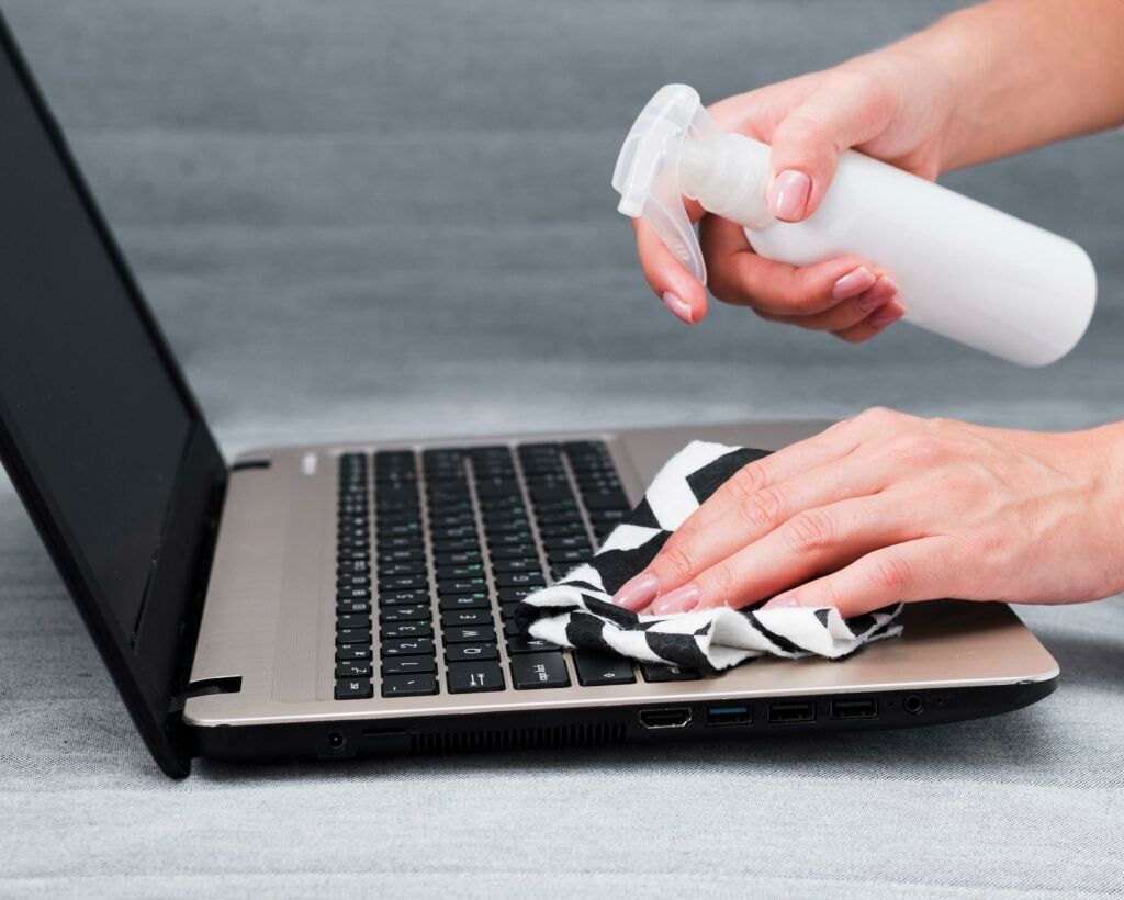 hands-disinfecting-laptop-keyboard-1024x820.jpg