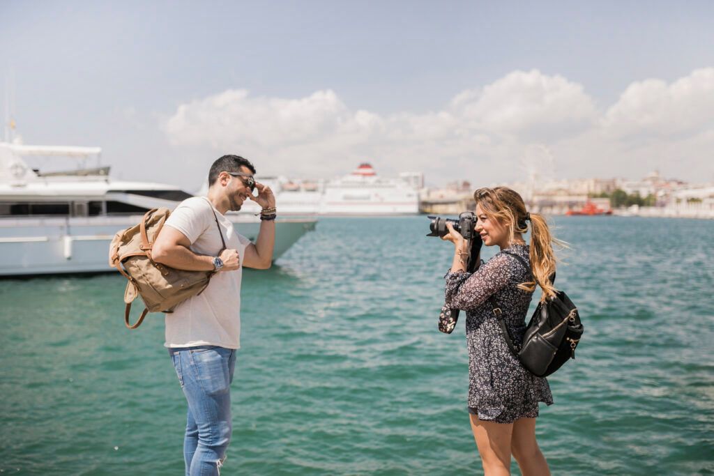 woman-taking-photograph-her-boyfriend-camera-near-sea-1024x683.jpg