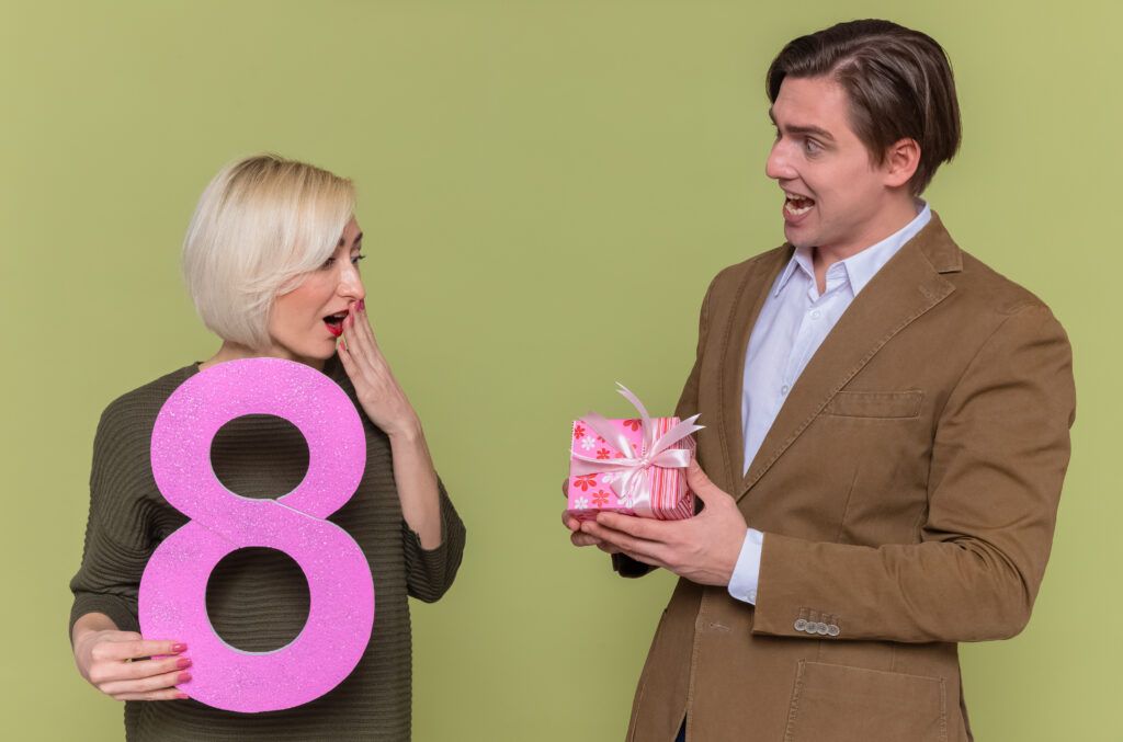 young-beautiful-couple-happy-man-giving-present-his-surprised-girlfriend-1024x677.jpg
