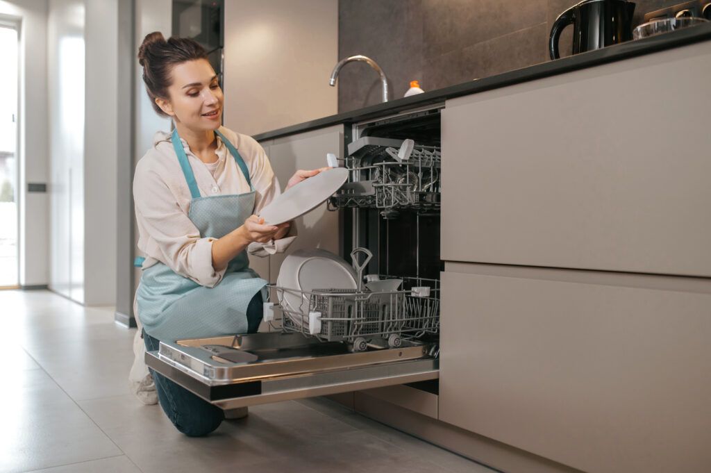 young-woman-apron-cleaning-crockery-1024x681.jpg