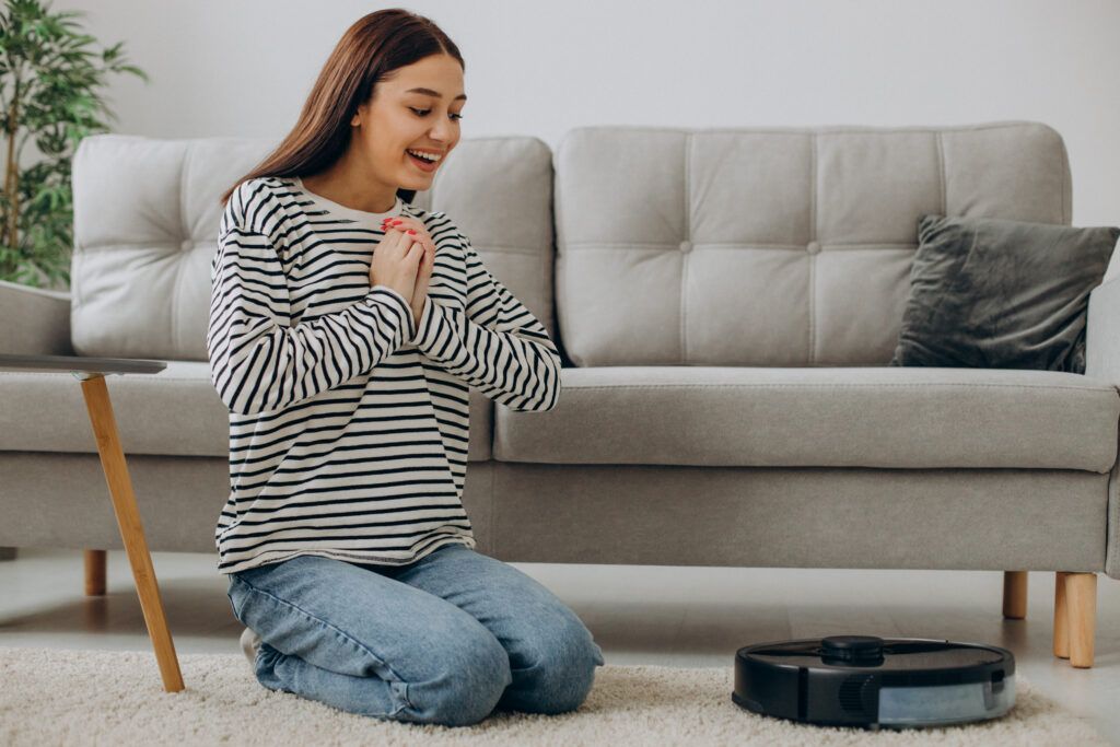 woman-relaxing-while-robot-vacuum-cleaner-cleaning-up-room-1024x683.jpg
