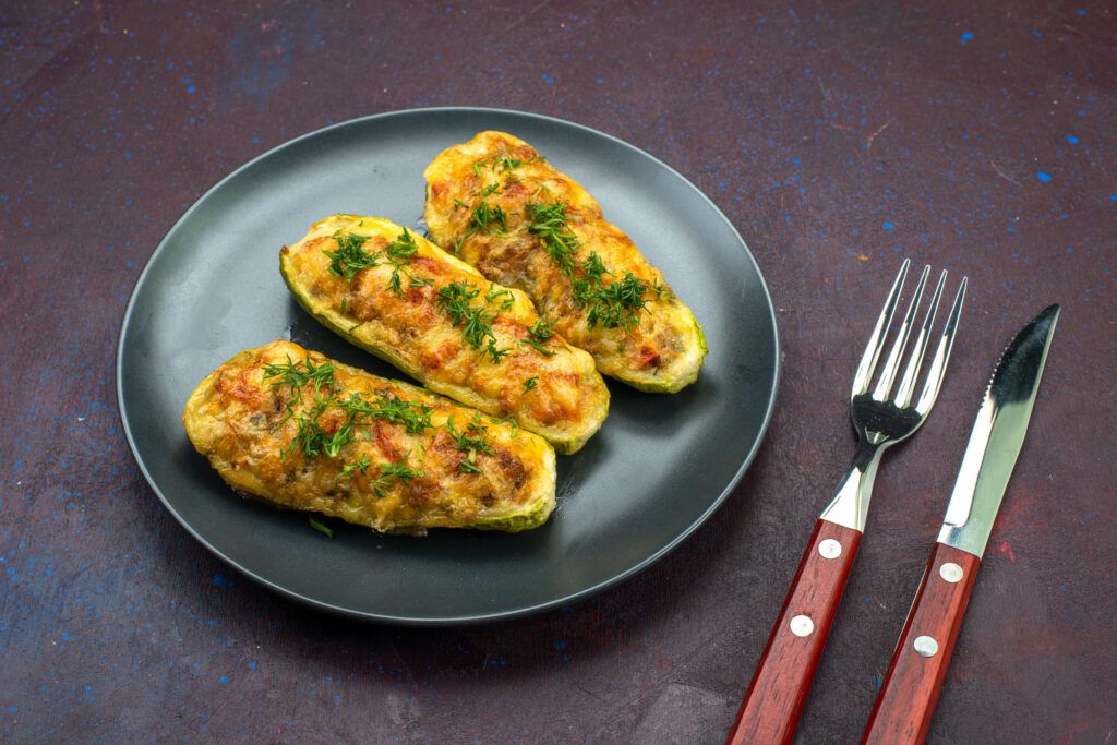 front-view-tasty-baked-squashes-with-greens-inside-plate-dark-background-1024x683.jpg