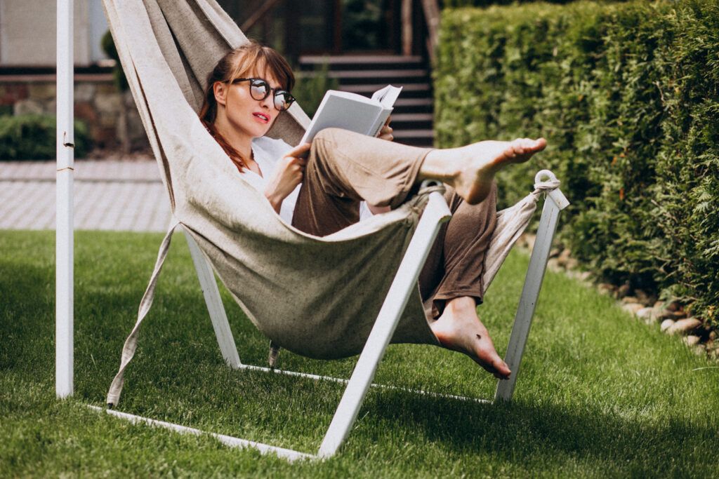 woman-reading-book-garden-by-house-1024x683.jpg