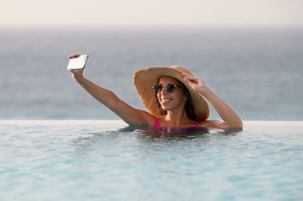 young-woman-taking-selfie-with-her-smartphone-vacation-1-1024x681.jpg