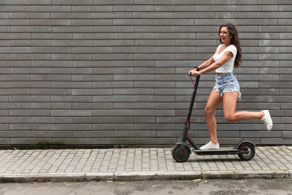 side-view-happy-woman-riding-electric-scooter-1024x683.jpg